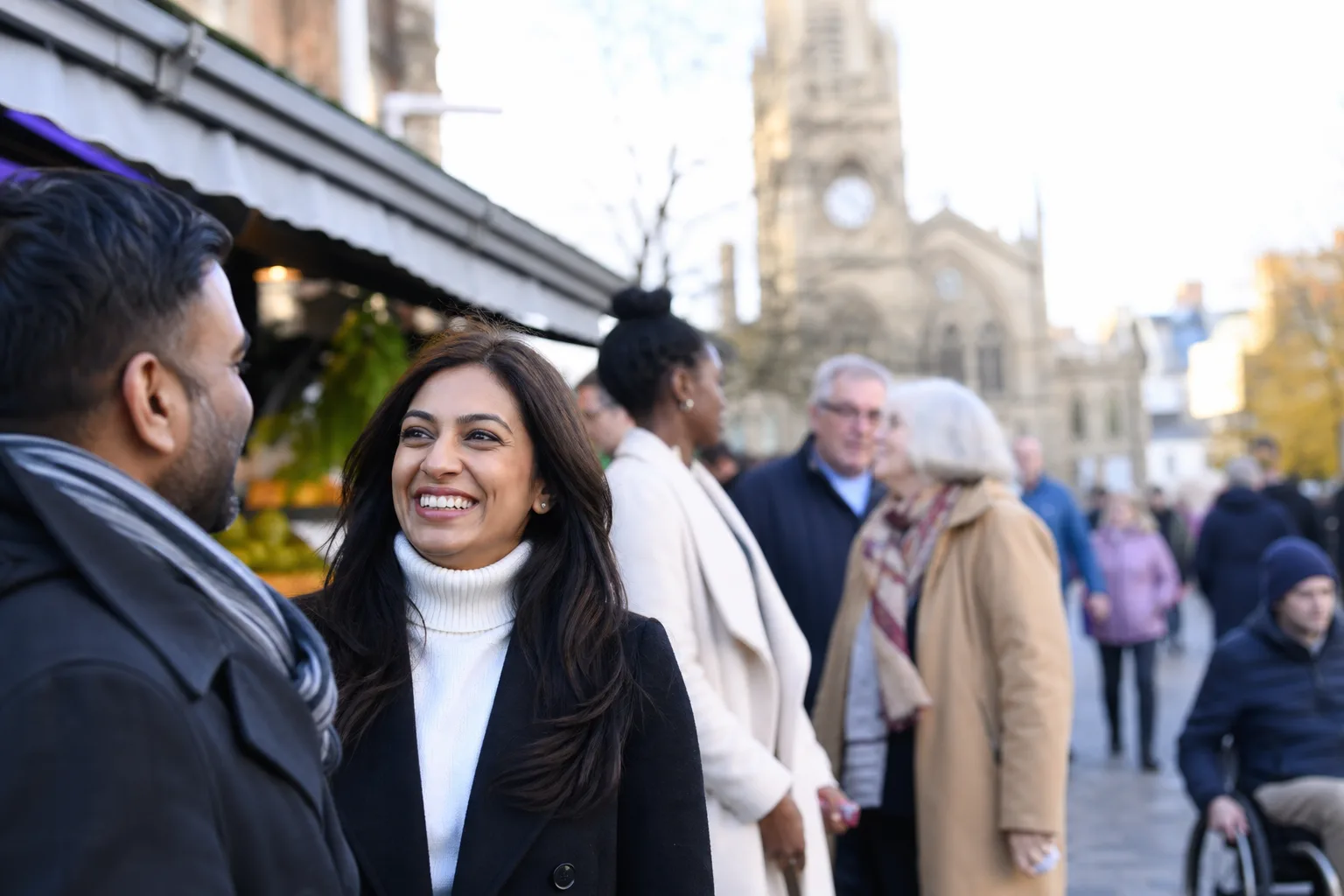 Two people talking over coffee in Leicester city centre